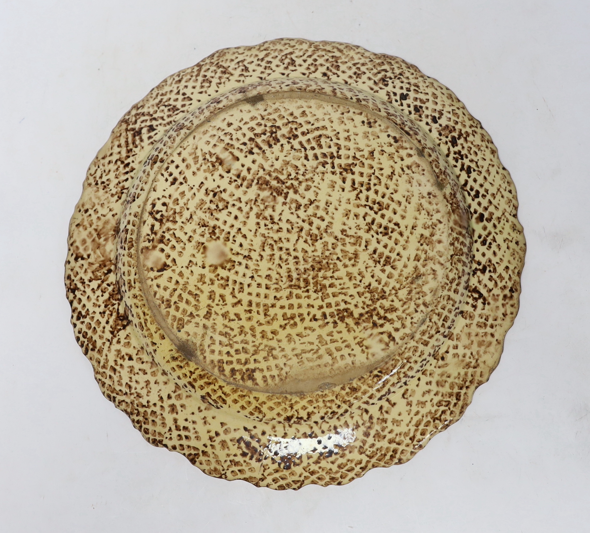 A mid 18th century Whieldon ‘’tortoiseshell’’ creamware dish, 36cm in diameter